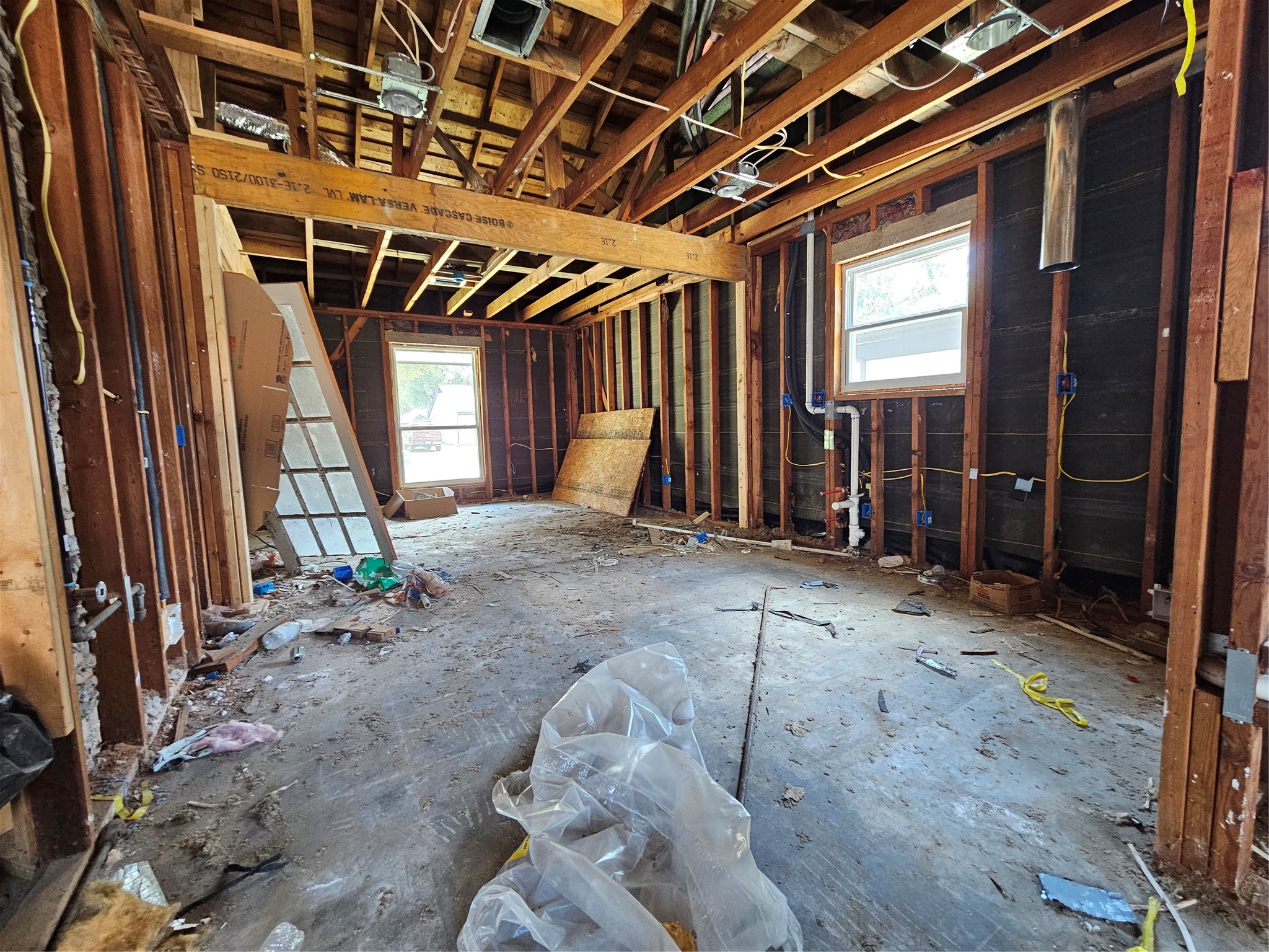5706 Rutherglenn Drive Houston, TX 77096 - Photo 17 of 45 a view of an empty room with wooden walls