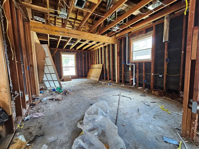a view of an empty room with wooden walls