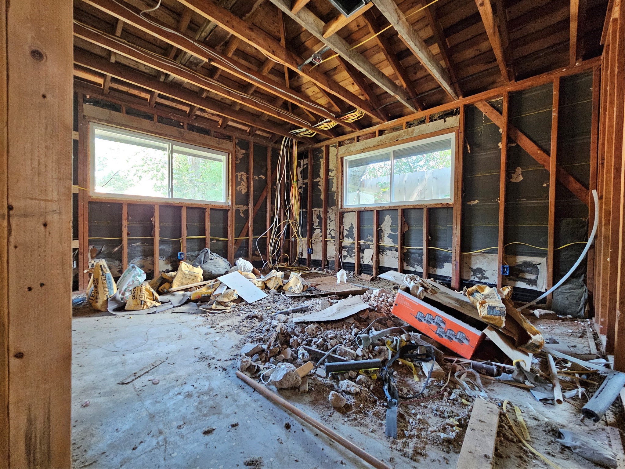 5706 Rutherglenn Drive Houston, TX 77096 - Photo 28 of 45 a living room with lots of furniture wooden floor and a large window