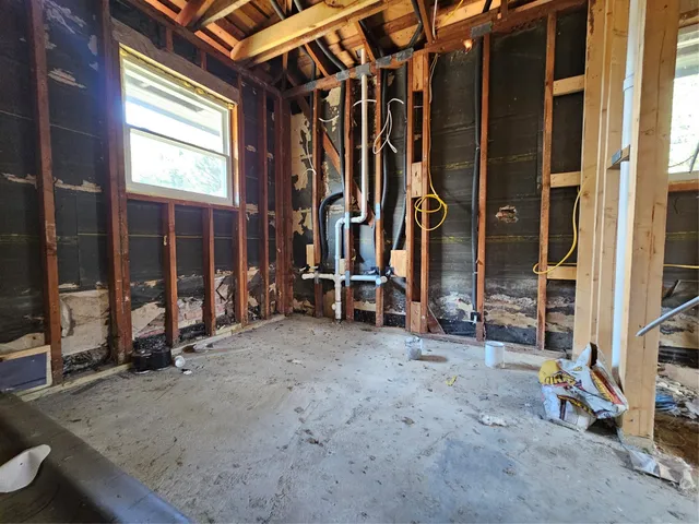 a view of porch with a black gate