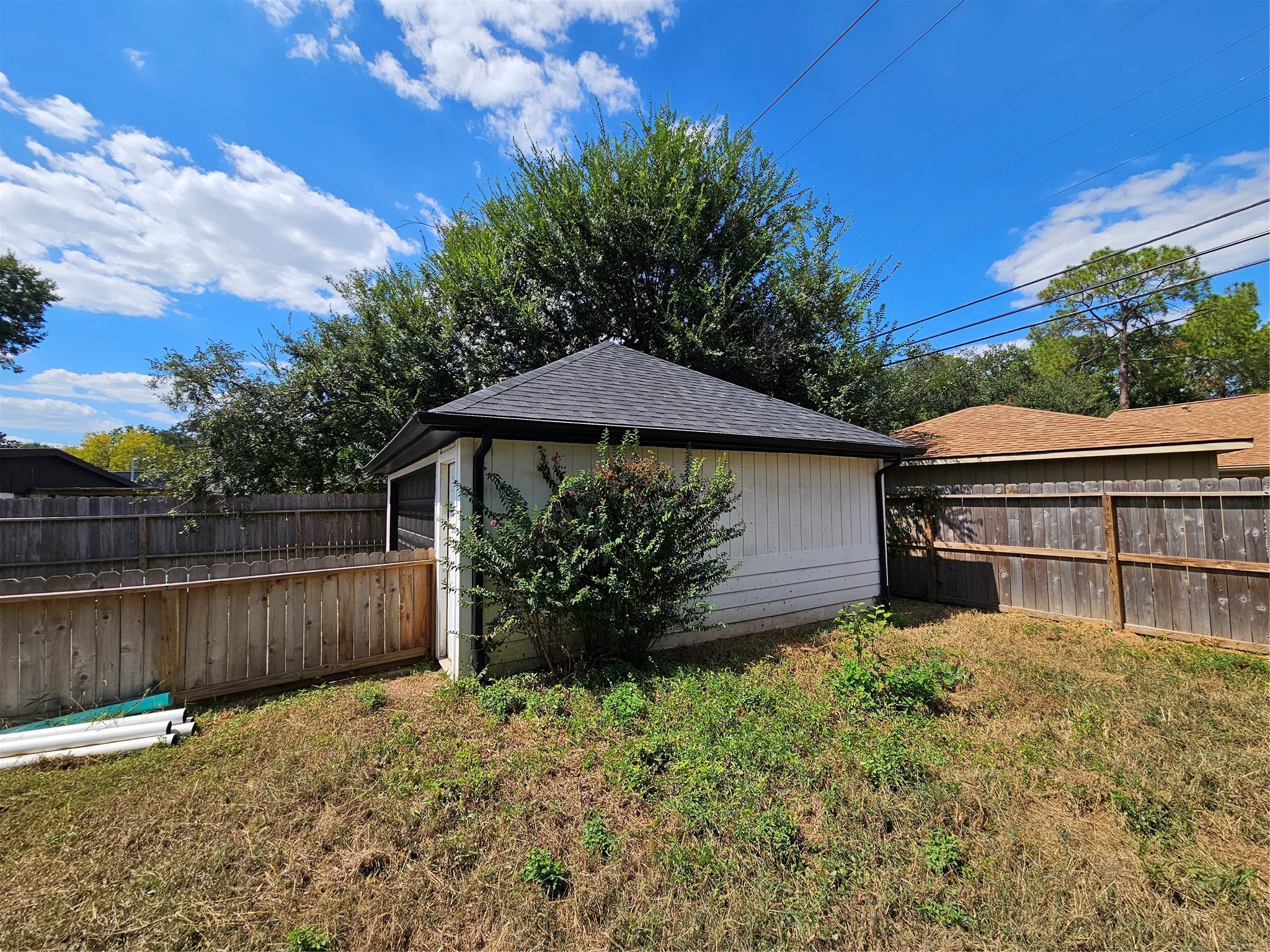 5706 Rutherglenn Drive Houston, TX 77096 - Photo 36 of 45 a backyard of a house with lots of green space