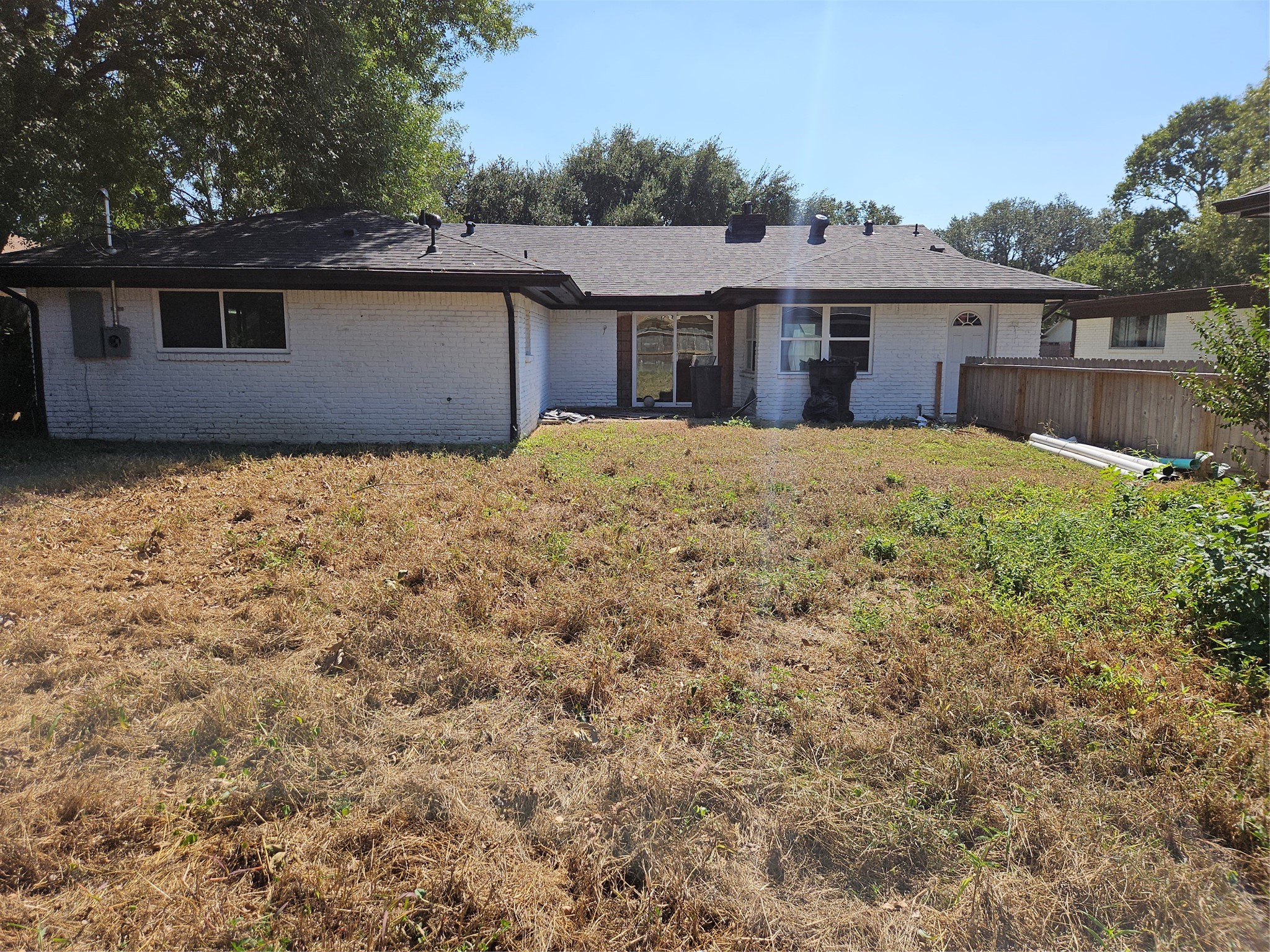 5706 Rutherglenn Drive Houston, TX 77096 - Photo 37 of 45 a front view of a house with a yard