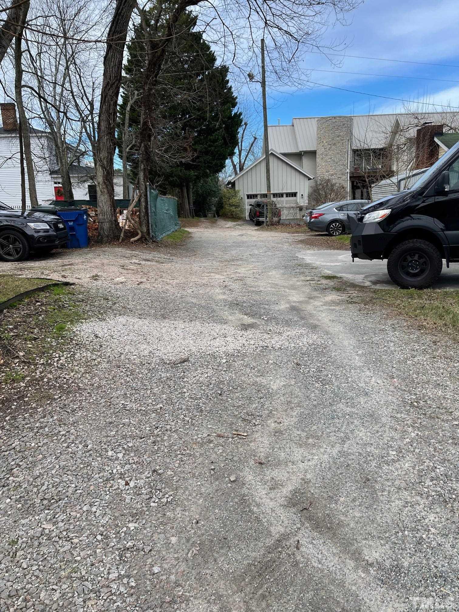 561 New Bern Avenue Raleigh, NC 27601 - Photo 15 of 15 a view of a parking space with cars parked in front of it