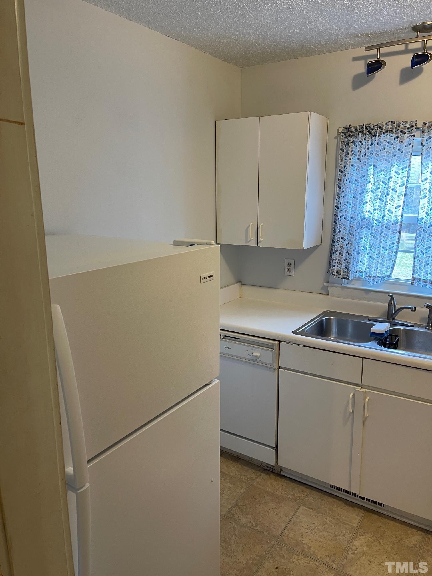 561 New Bern Avenue Raleigh, NC 27601 - Photo 7 of 15 a utility room with dryer and washer