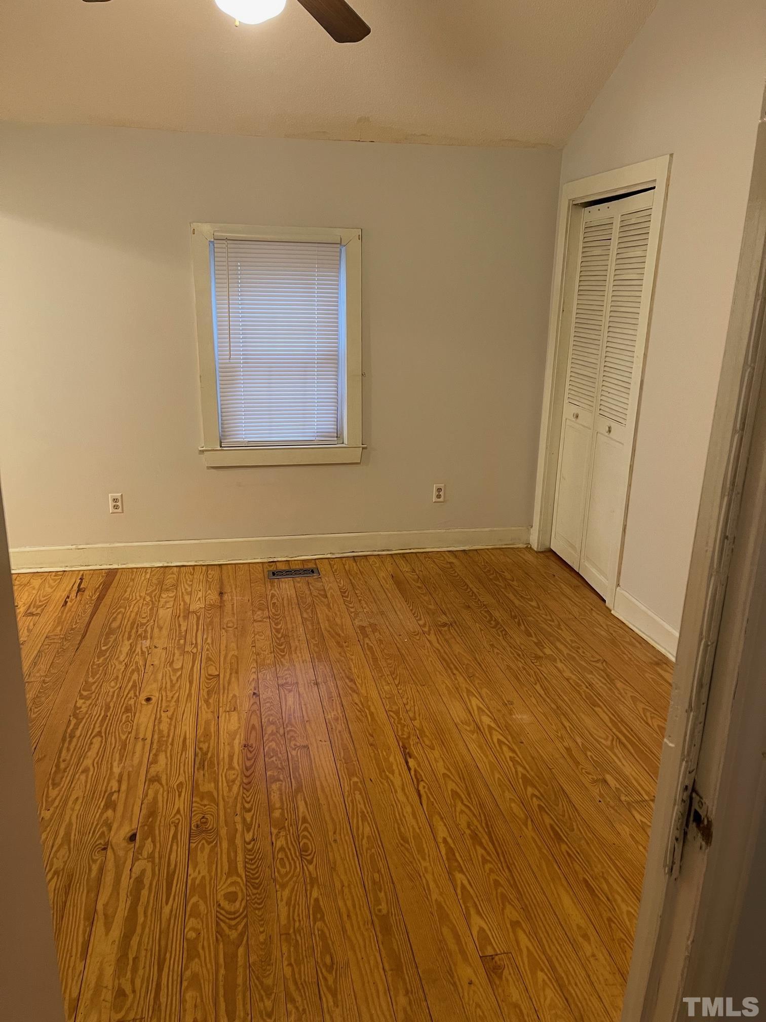 561 New Bern Avenue Raleigh, NC 27601 - Photo 9 of 15 a view of an empty room with wooden floor
