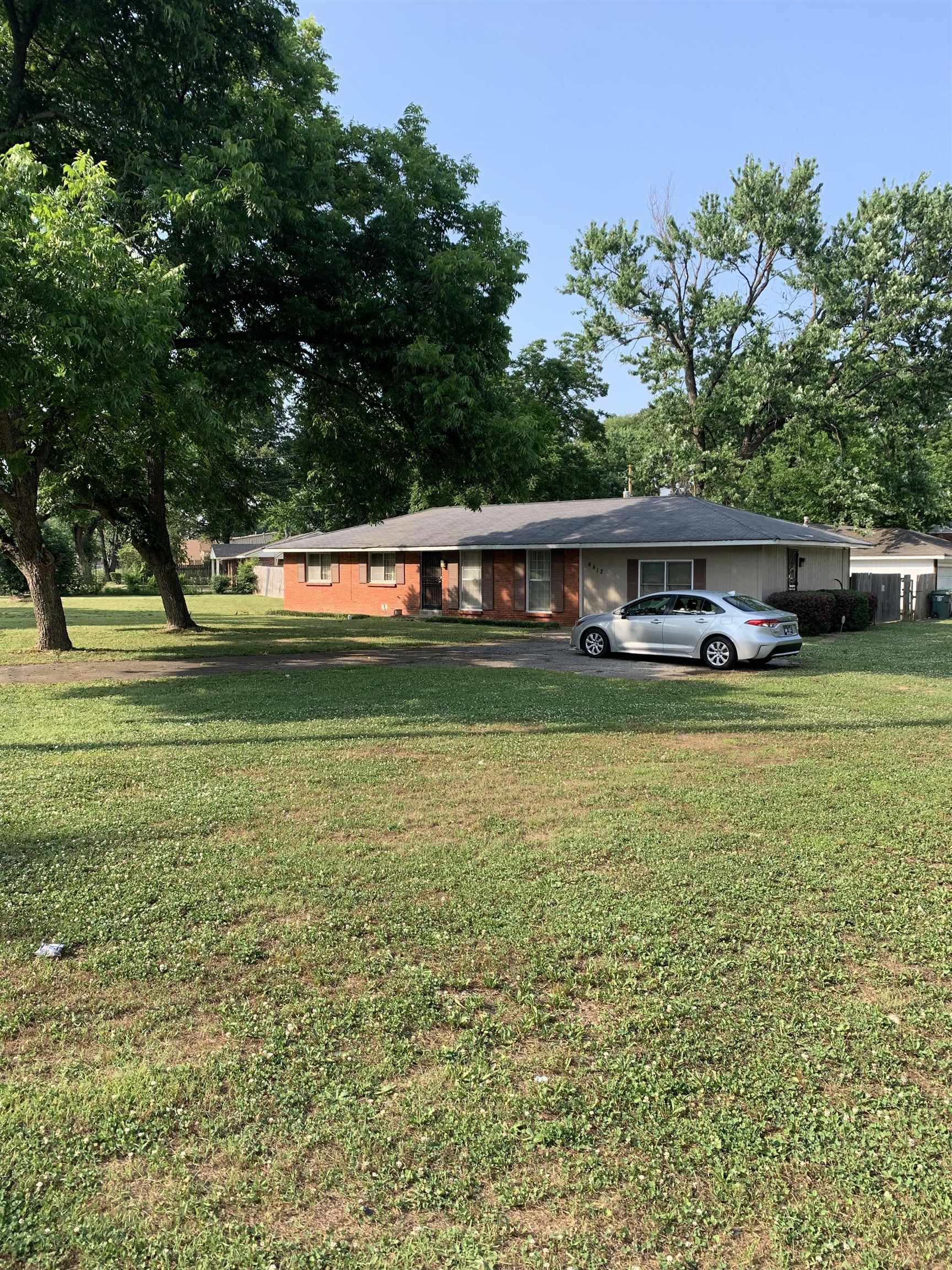 4412 Millbranch Road Memphis, TN 38116 - Photo 2 of 15 a view of a house with a yard