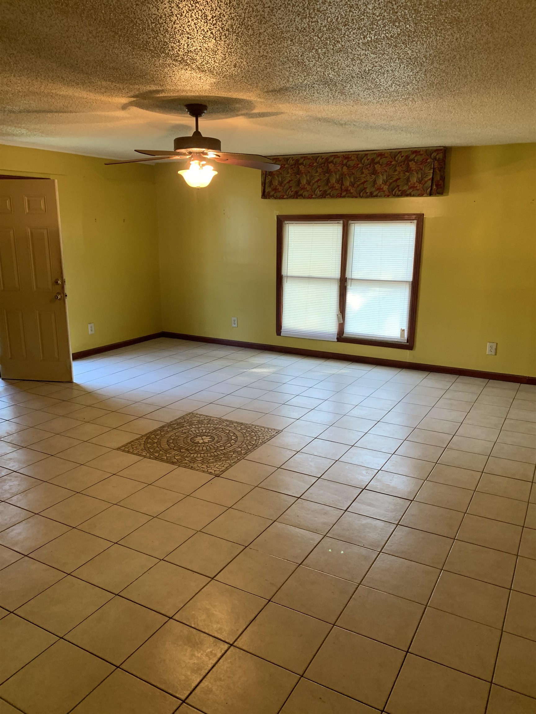 4412 Millbranch Road Memphis, TN 38116 - Photo 5 of 15 a view of empty room with wooden floor