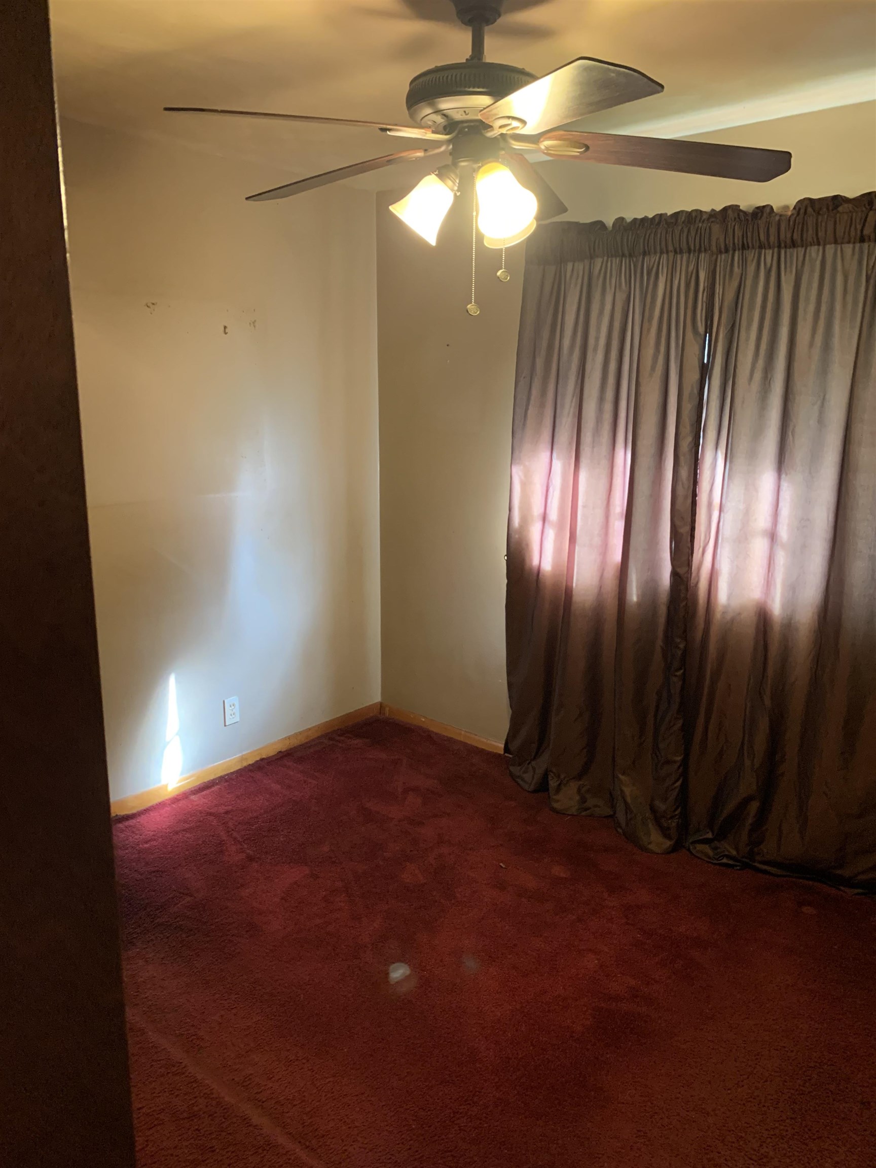 4412 Millbranch Road Memphis, TN 38116 - Photo 7 of 15 a view of an empty room with a fan