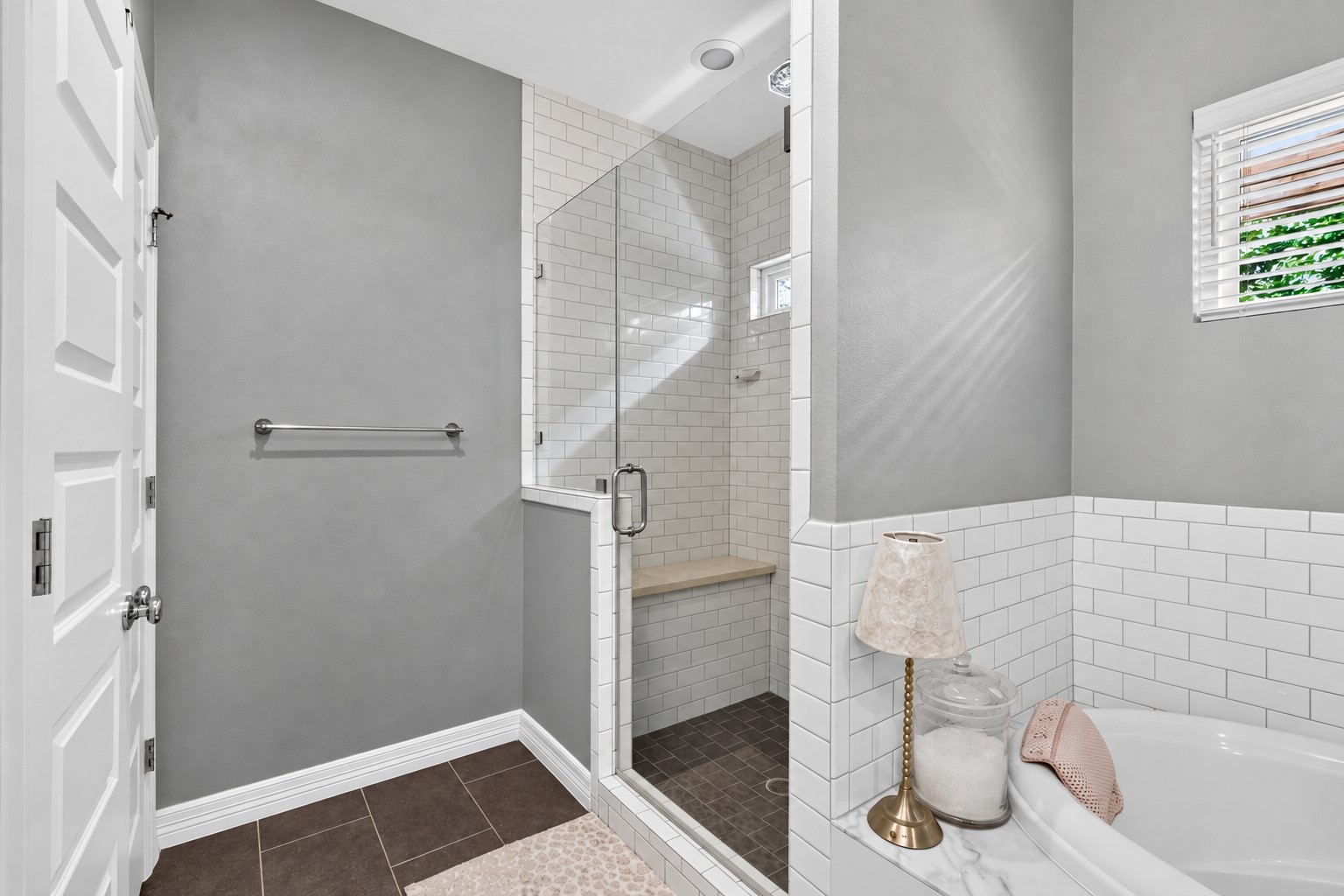 1722 Chippendale Road Houston, TX 77018 - Photo 21 of 41 Spacious walk-in shower with subway tile, a cozy bench.