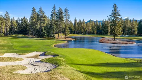 a view of a swimming pool with a yard