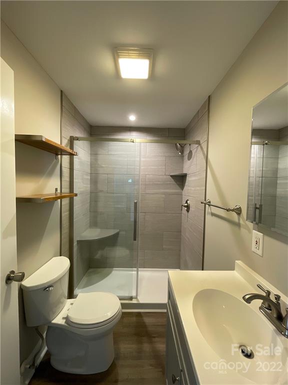 707 Grandin Road Charlotte, NC 28208 - Photo 13 of 19 a bathroom with a sink and mirror