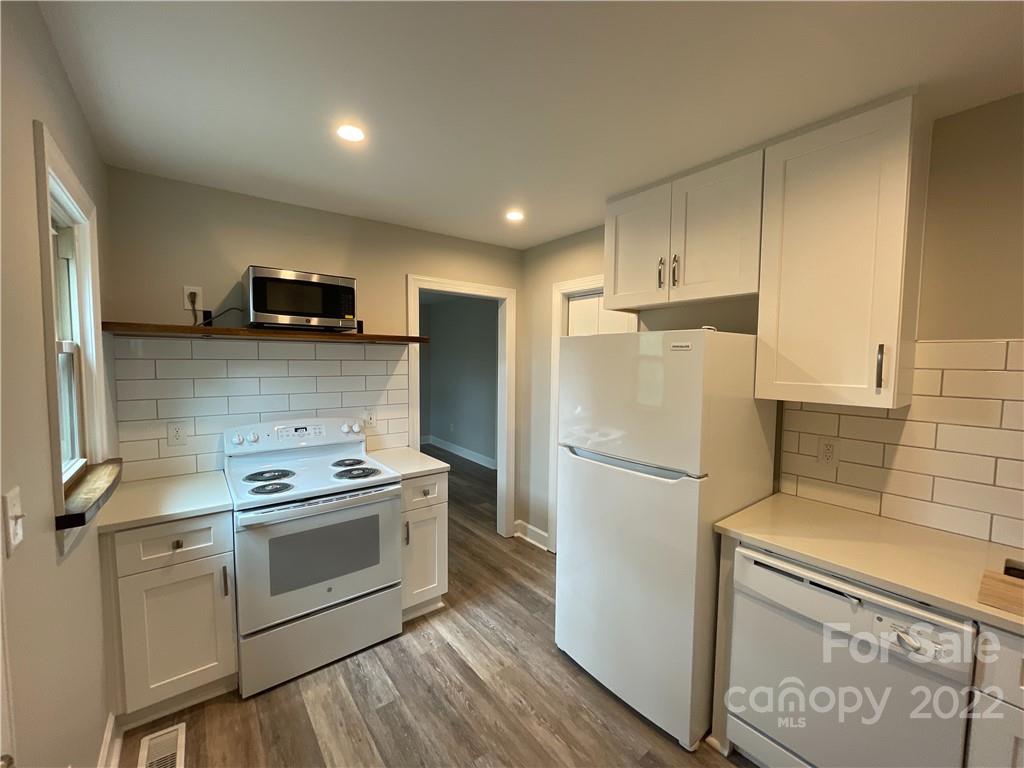 707 Grandin Road Charlotte, NC 28208 - Photo 15 of 19 a kitchen with stainless steel appliances a refrigerator sink and microwave