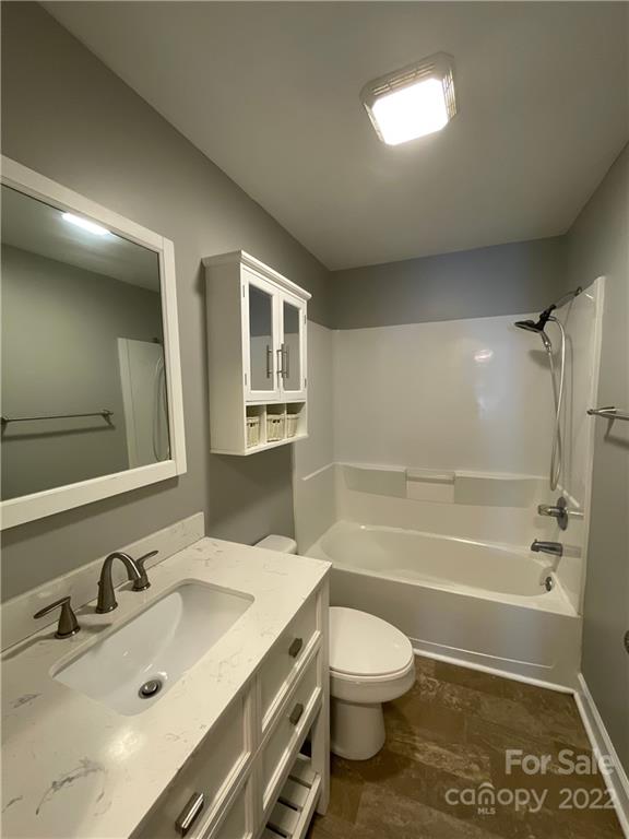 707 Grandin Road Charlotte, NC 28208 - Photo 7 of 19 a bathroom with a sink a toilet and shower