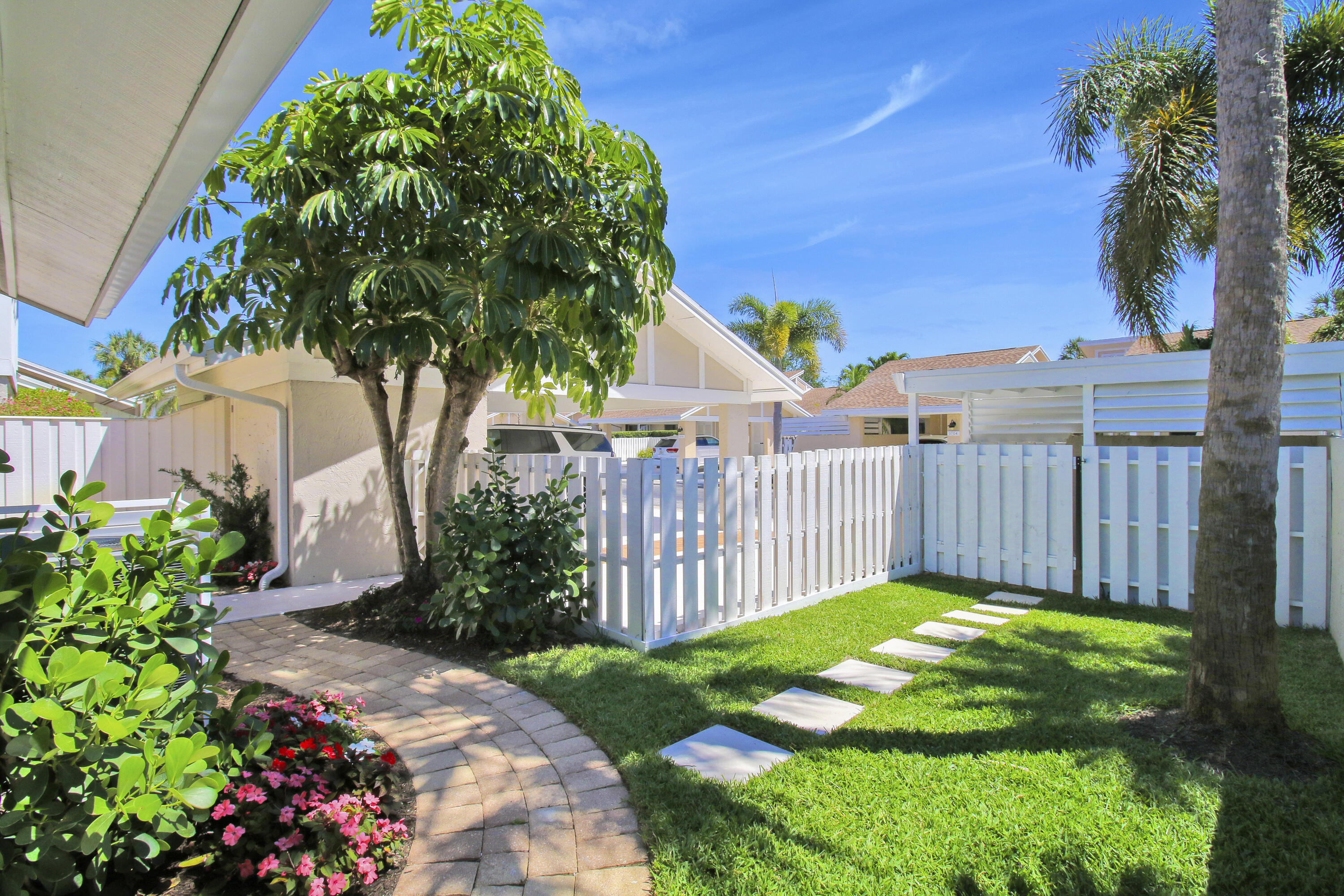 3703 Cape Pointe Circle Jupiter, FL 33477 - Photo 1 of 55 a garden view