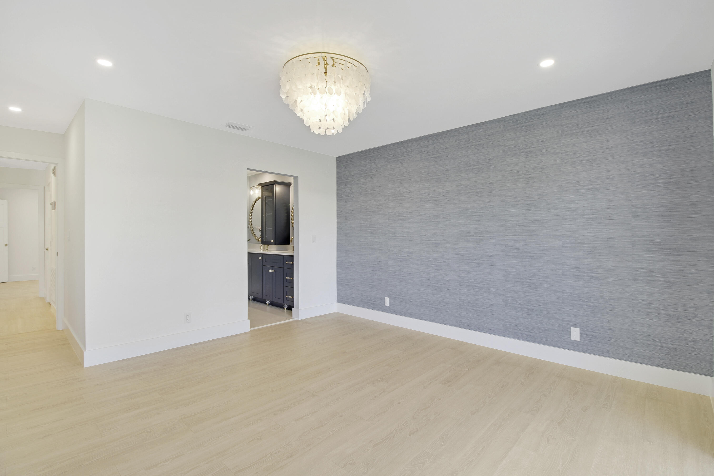 3703 Cape Pointe Circle Jupiter, FL 33477 - Photo 24 of 55 an empty room with wooden floor and workspace
