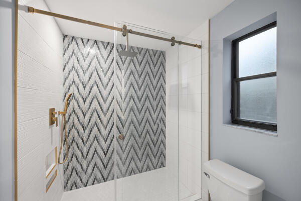 3703 Cape Pointe Circle Jupiter, FL 33477 - Photo 30 of 55 a bathroom with a shower curtain and a toilet