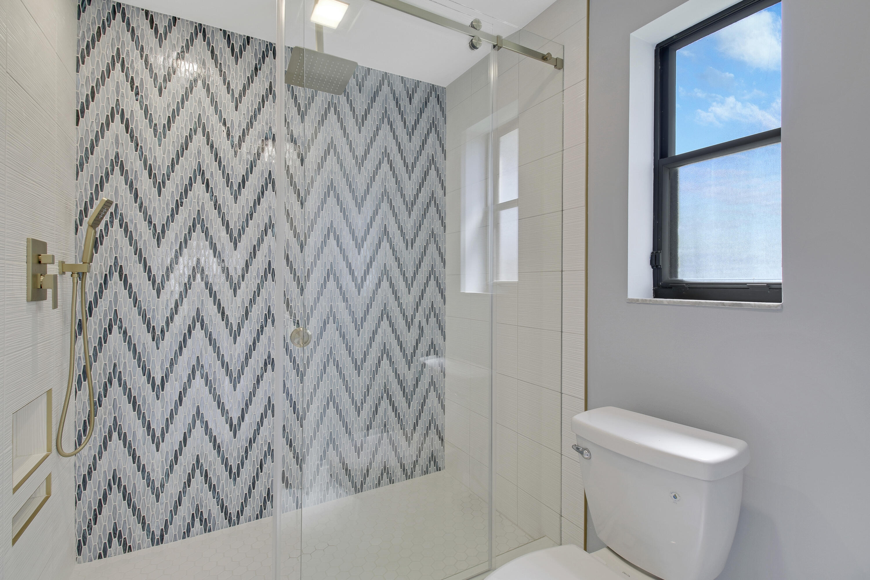 3703 Cape Pointe Circle Jupiter, FL 33477 - Photo 31 of 55 a bathroom with a shower curtain and a toilet