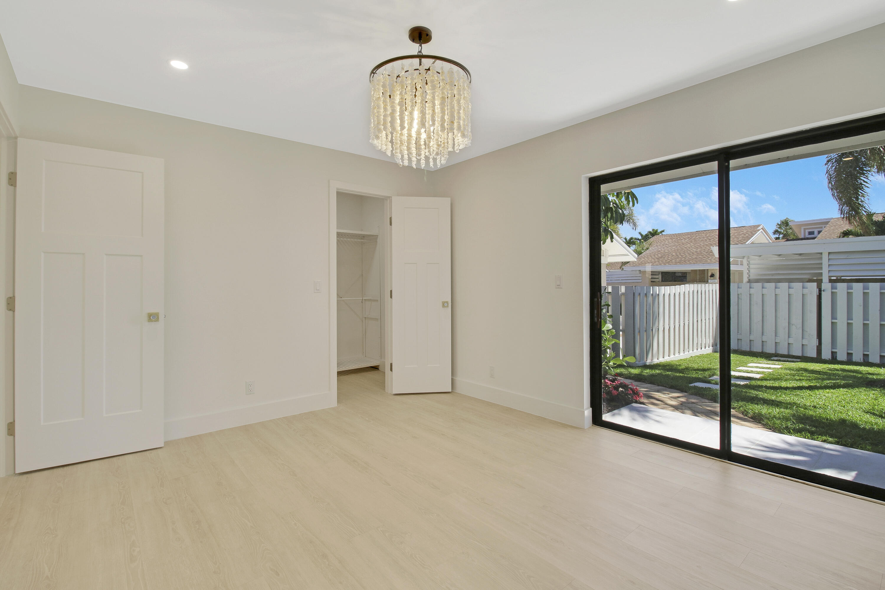 3703 Cape Pointe Circle Jupiter, FL 33477 - Photo 35 of 55 a view of empty room with floor to ceiling window