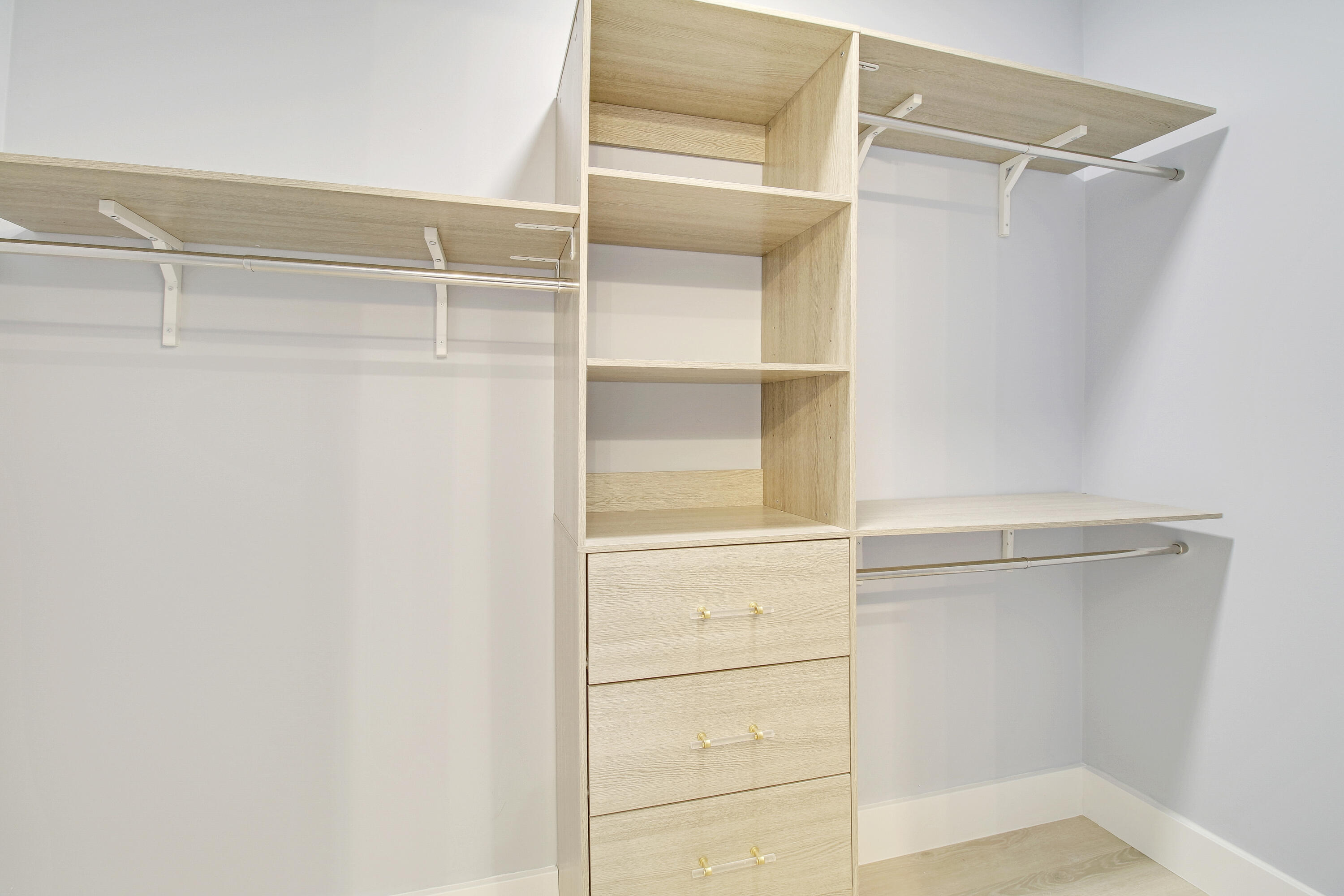 3703 Cape Pointe Circle Jupiter, FL 33477 - Photo 36 of 55 a view of walk in closet with empty racks