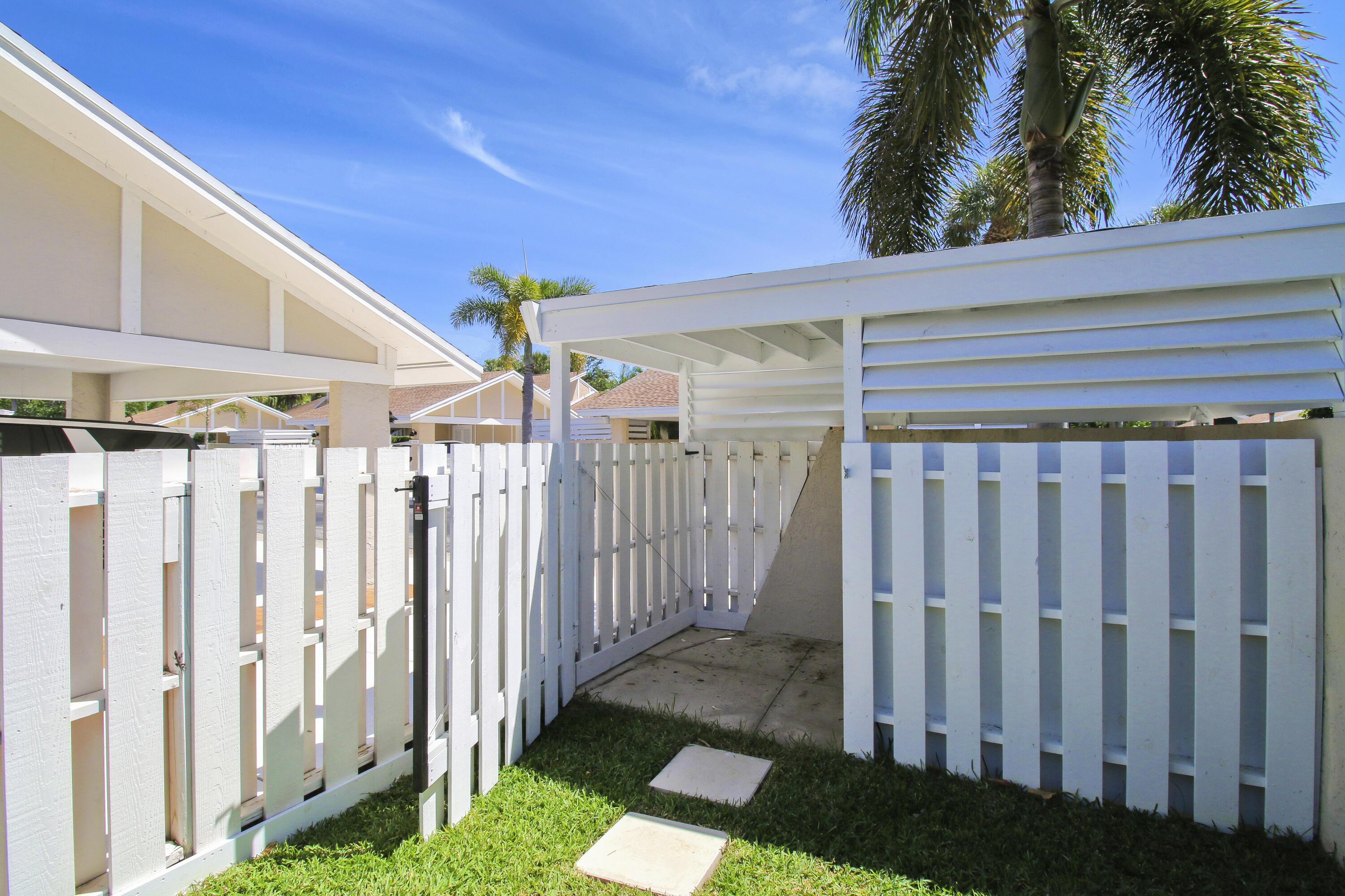 3703 Cape Pointe Circle Jupiter, FL 33477 - Photo 41 of 55 a view of a wooden fence