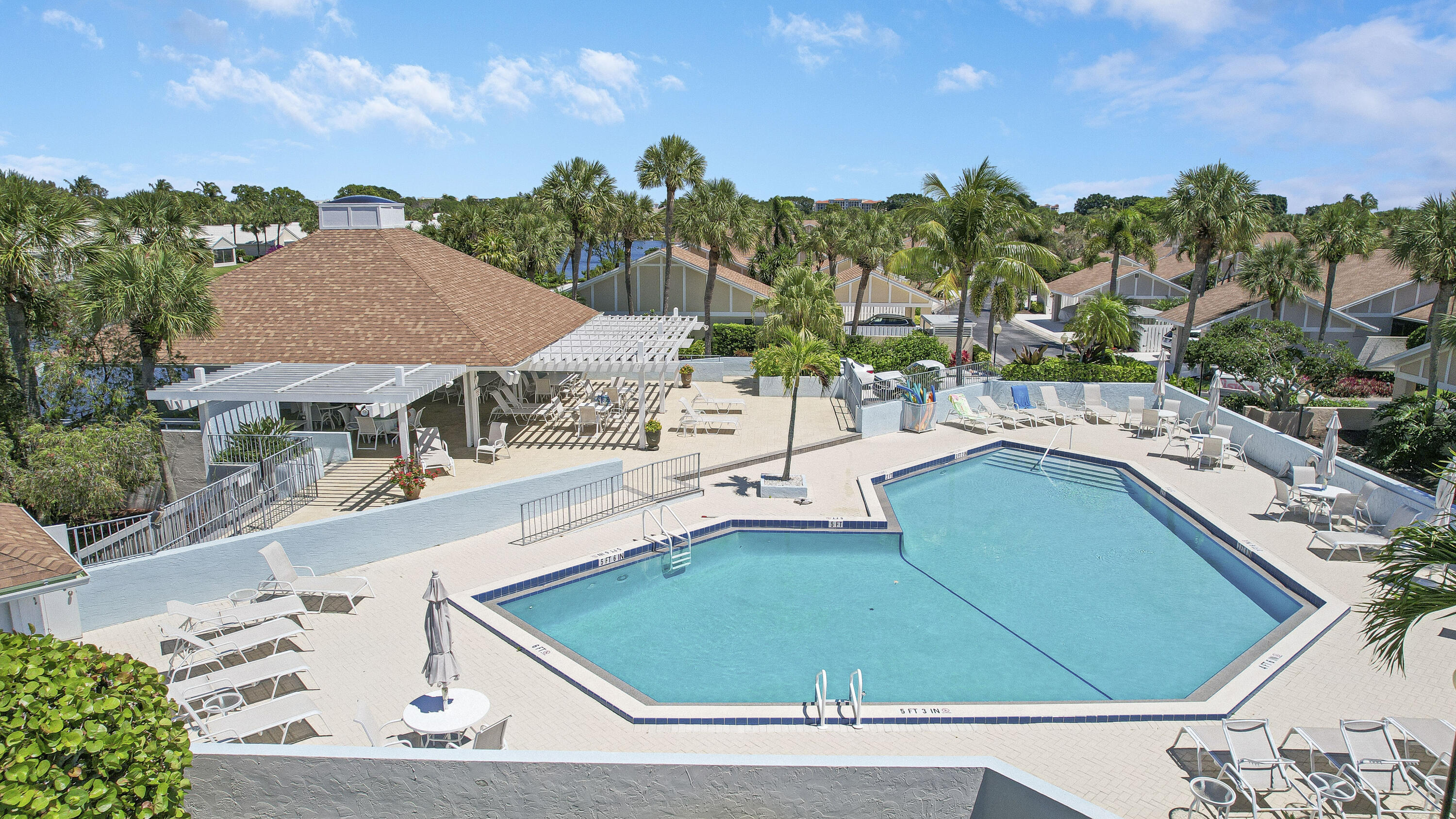 3703 Cape Pointe Circle Jupiter, FL 33477 - Photo 47 of 55 a view of a patio with swimming pool