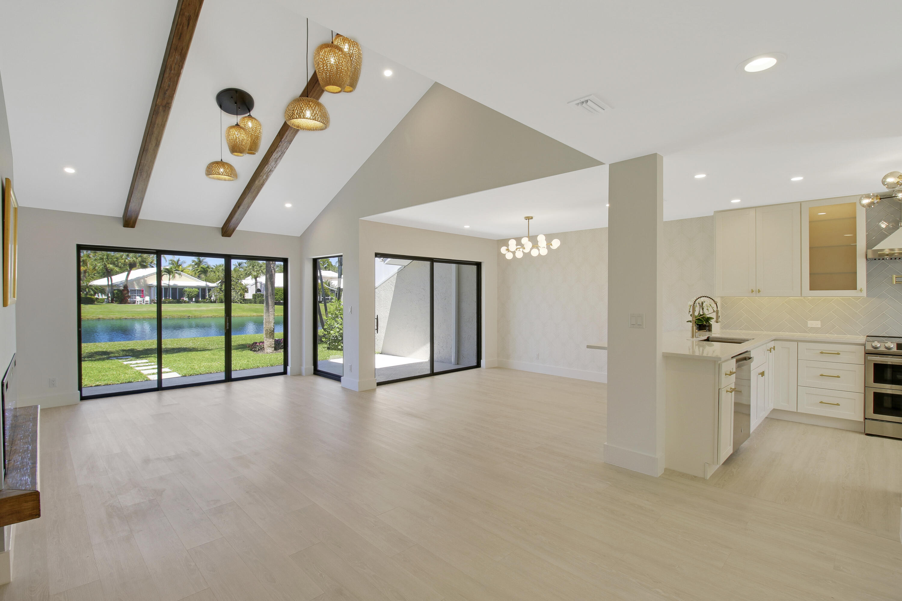 3703 Cape Pointe Circle Jupiter, FL 33477 - Photo 6 of 55 a view of a livingroom with furniture and staircase