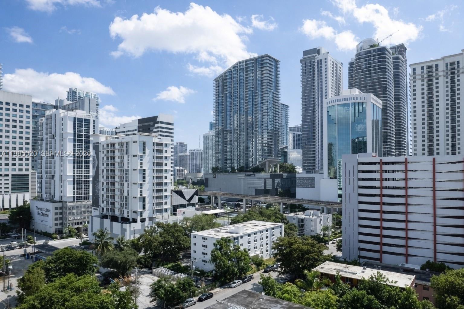 143 Southwest 9th Street, Unit 105 Miami, FL 33130 - Photo 3 of 20 a view of a city with tall buildings