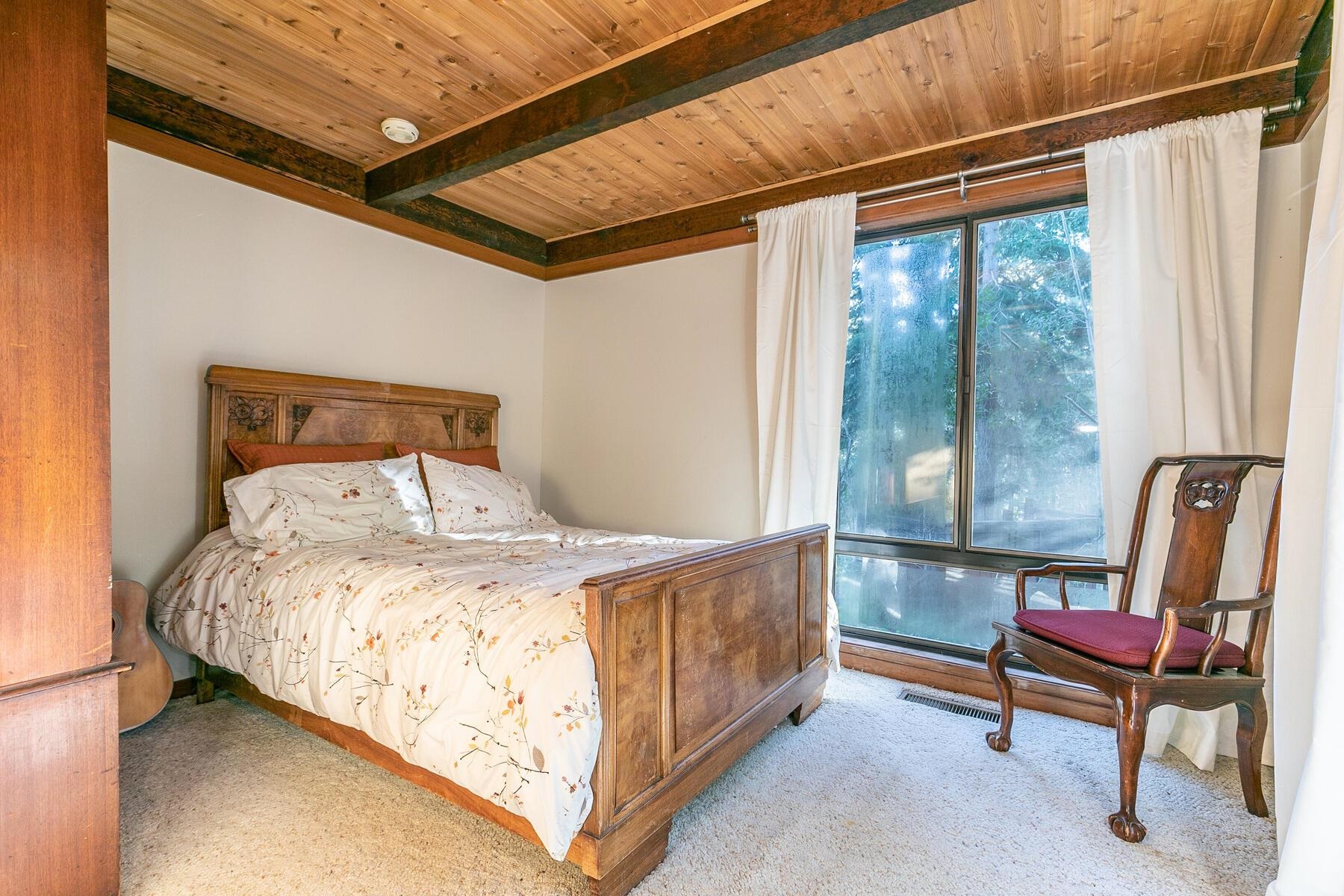 1469 Sandy Way Olympic Valley, CA 96146 - Photo 14 of 21 a bedroom with a bed chair and window