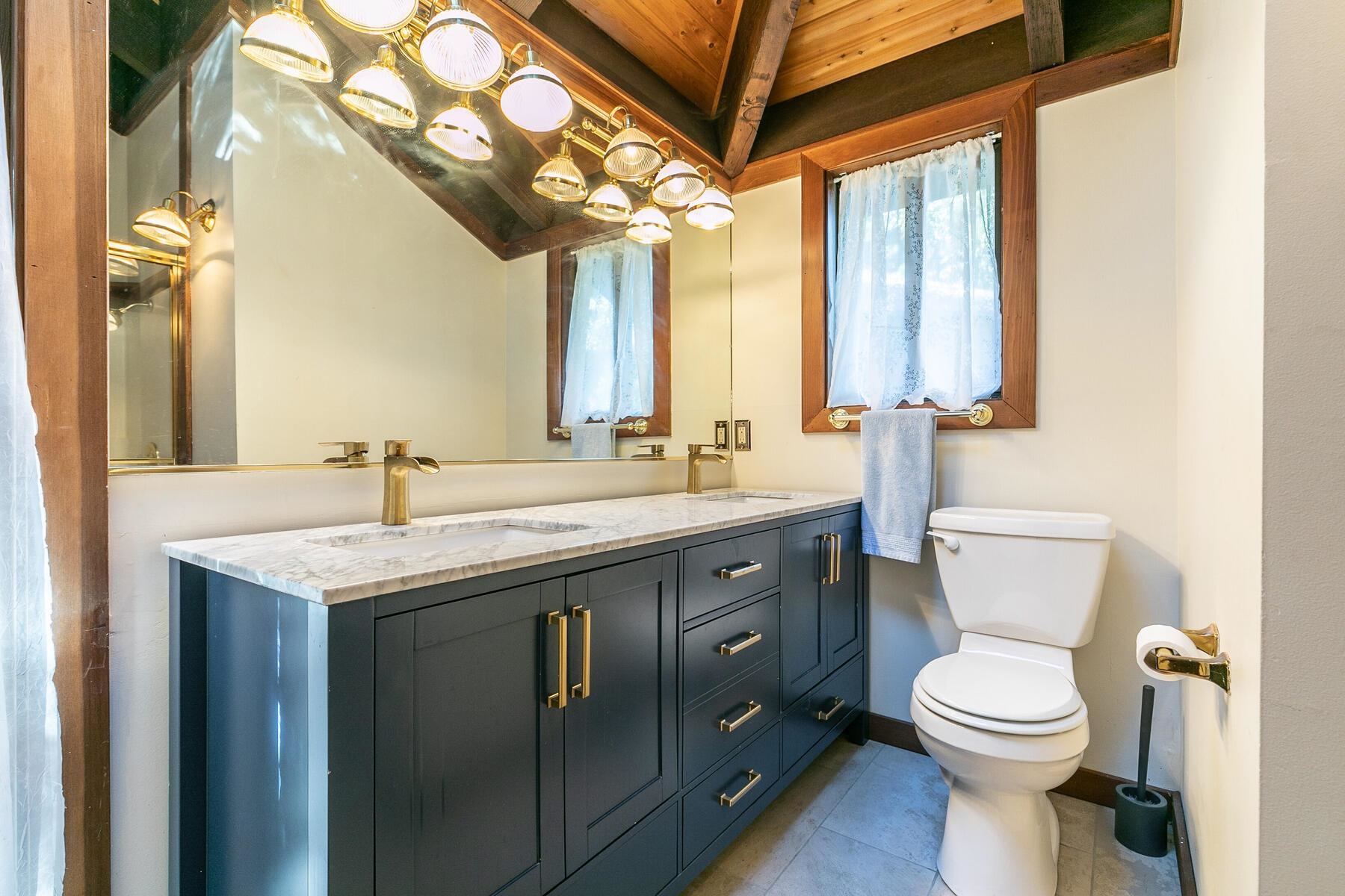 1469 Sandy Way Olympic Valley, CA 96146 - Photo 15 of 21 a bathroom with a toilet sink and mirror