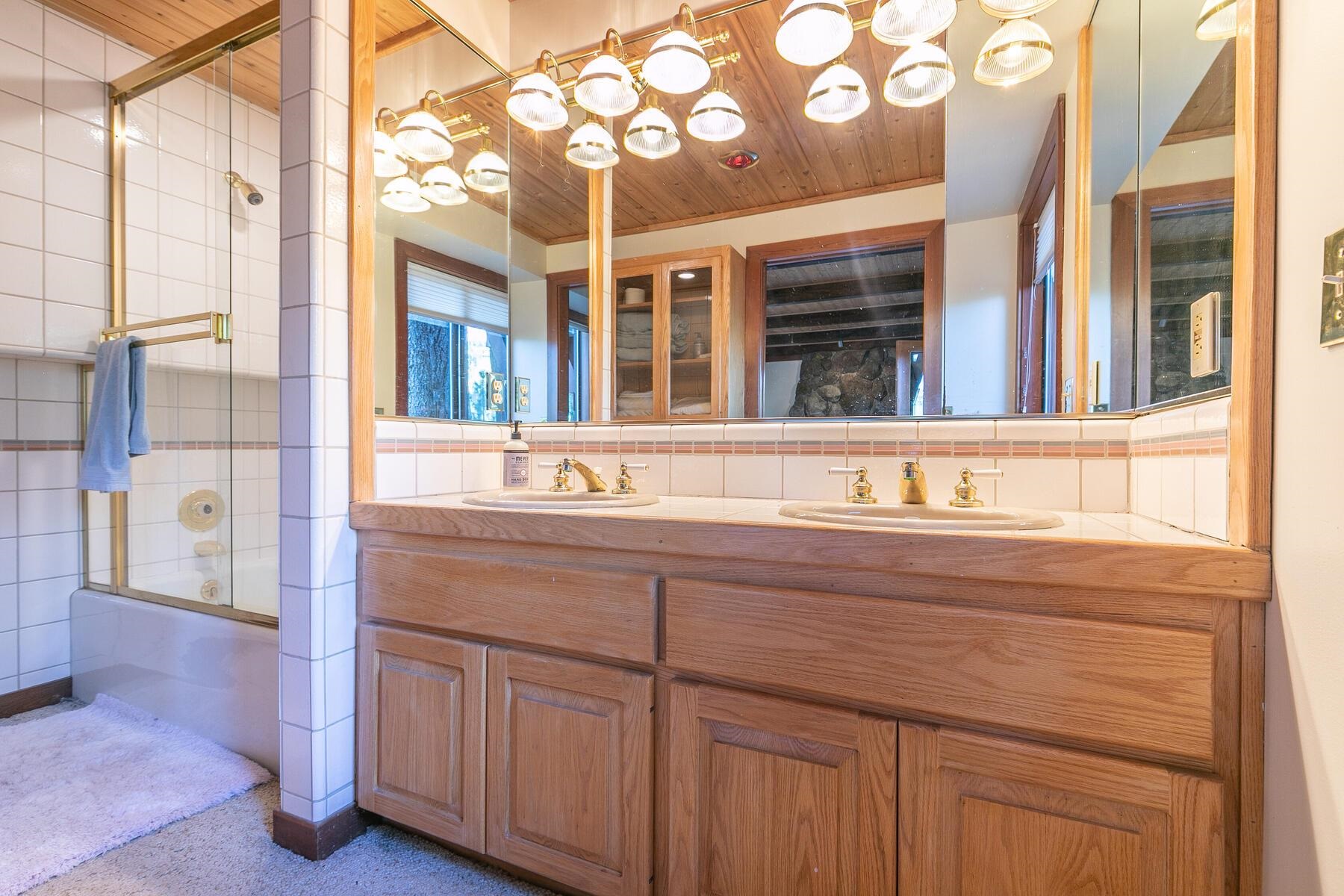 1469 Sandy Way Olympic Valley, CA 96146 - Photo 18 of 21 a bathroom with a sink and a mirror