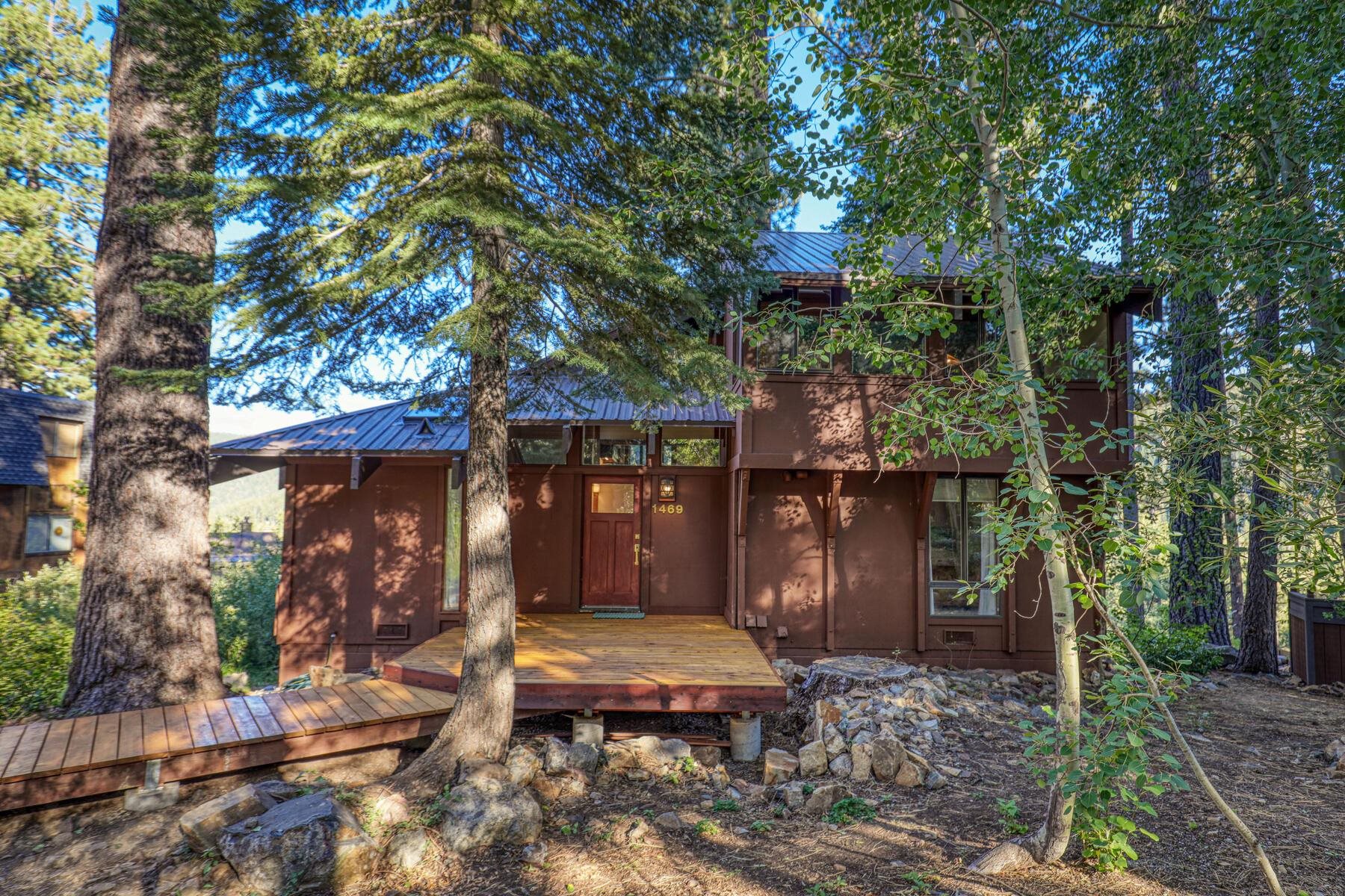 1469 Sandy Way Olympic Valley, CA 96146 - Photo 2 of 21 a view of a chairs and tables in the backyard of the house