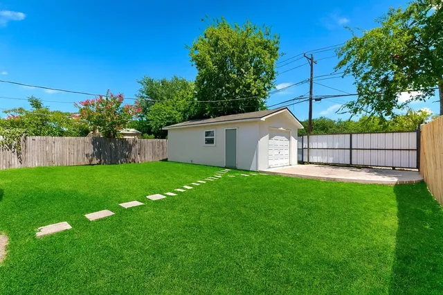 a view of a backyard with a small cabin
