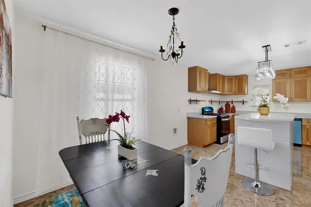 a view of kitchen and dining room with furniture