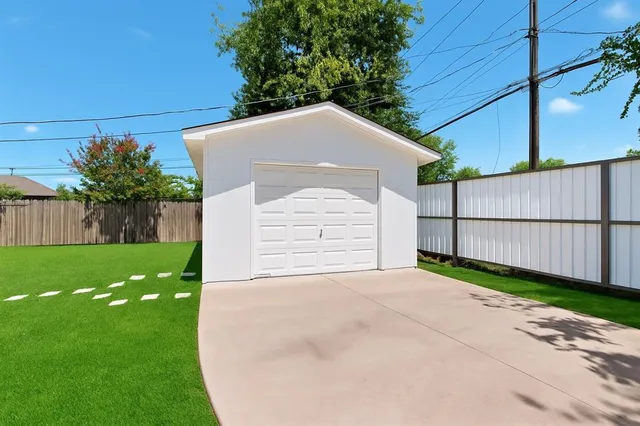 a view of a house with a yard and plants