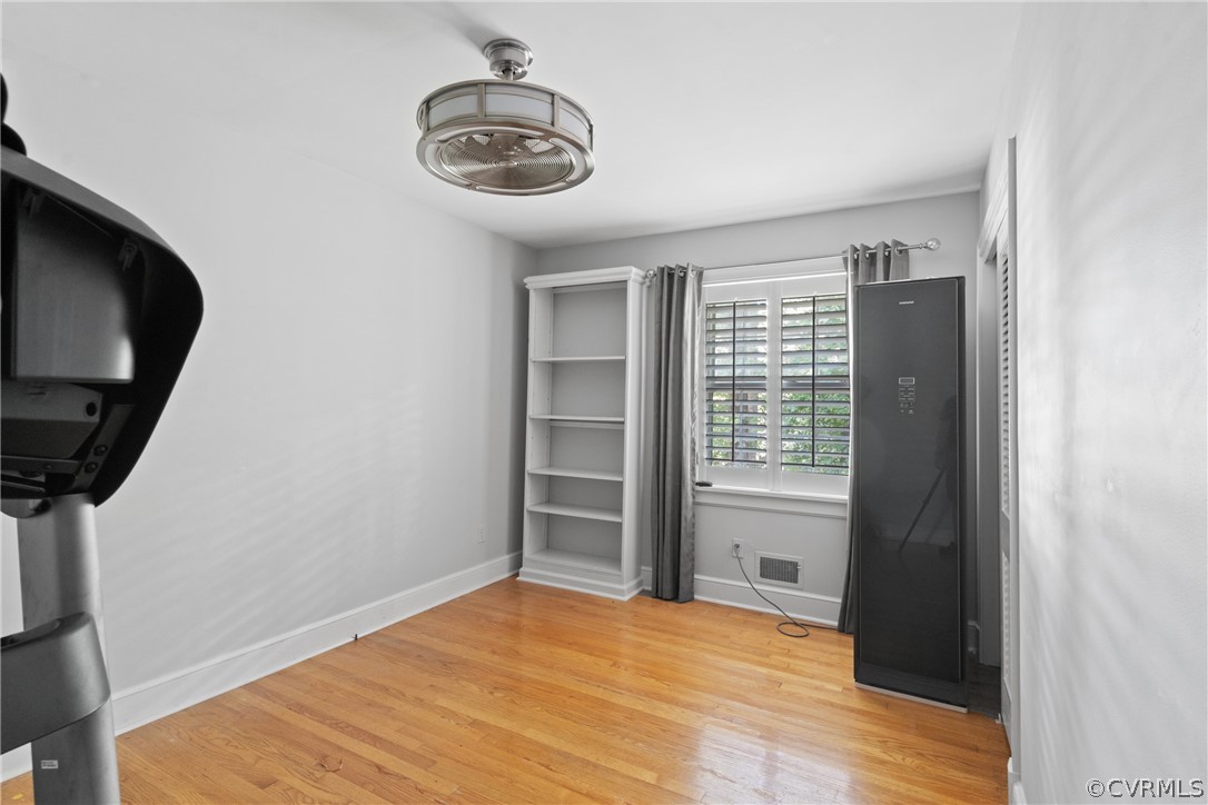 4430 Croatan Road Richmond, VA 23235 - Photo 28 of 44 a view of empty room with wooden floor and fan