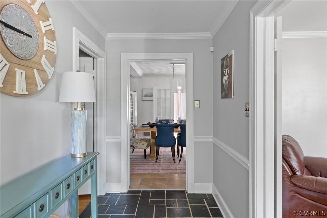 4430 Croatan Road Richmond, VA 23235 - Photo 3 of 44 a hallway with dining area and chandelier