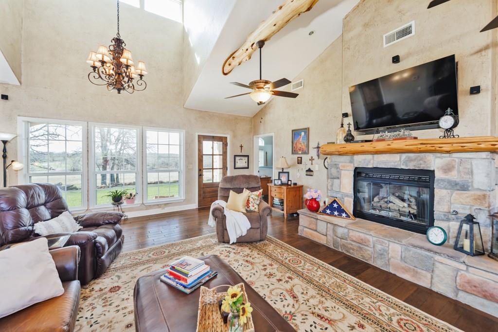 4460 Hildreth Pool Road Bowie, TX 76230 - Photo 6 of 40 a living room with furniture fireplace and flat screen tv