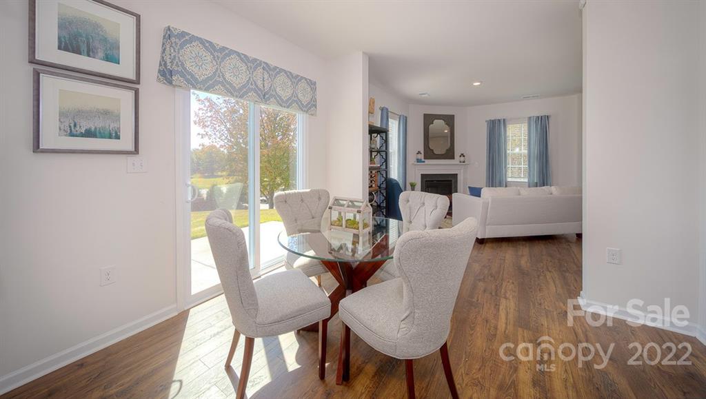 309 Gaines Road Clover, SC 29710 - Photo 12 of 48 a view of a dining room with furniture and wooden floor