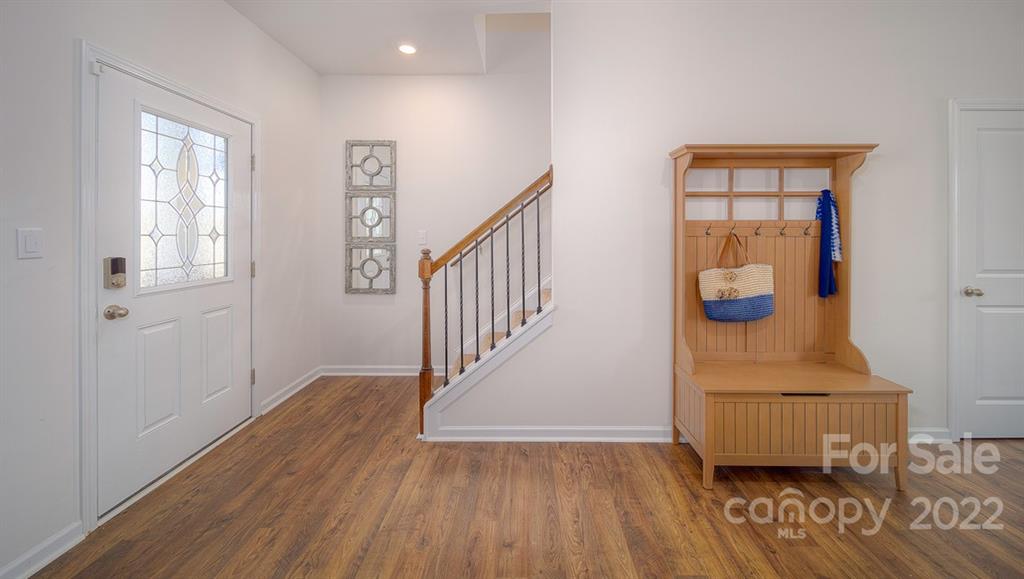 309 Gaines Road Clover, SC 29710 - Photo 22 of 48 a view of entryway with stairs and wooden floor