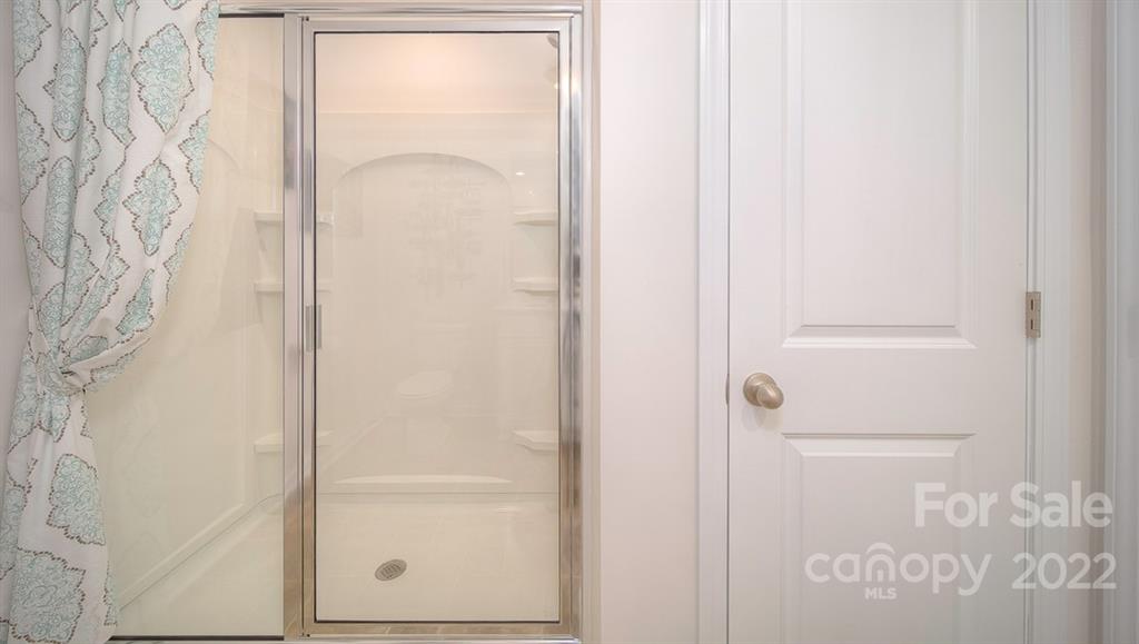 309 Gaines Road Clover, SC 29710 - Photo 30 of 48 a bathroom with a glass shower door
