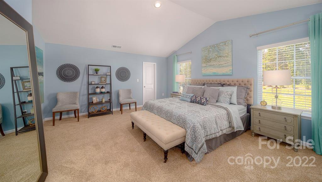 309 Gaines Road Clover, SC 29710 - Photo 33 of 48 a spacious bedroom with a bed and a window