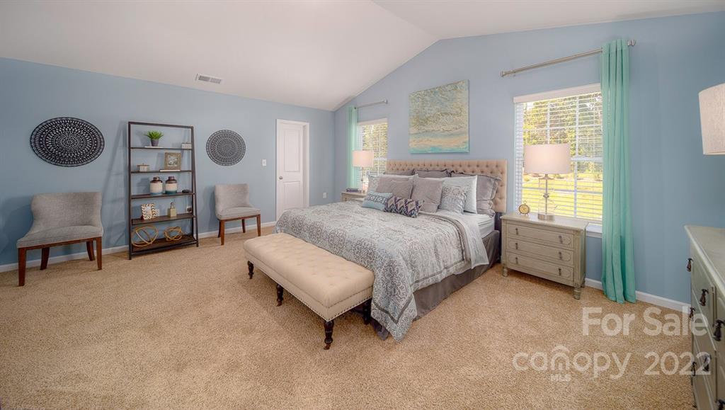 309 Gaines Road Clover, SC 29710 - Photo 34 of 48 a bedroom with a bed a window and a wall painting