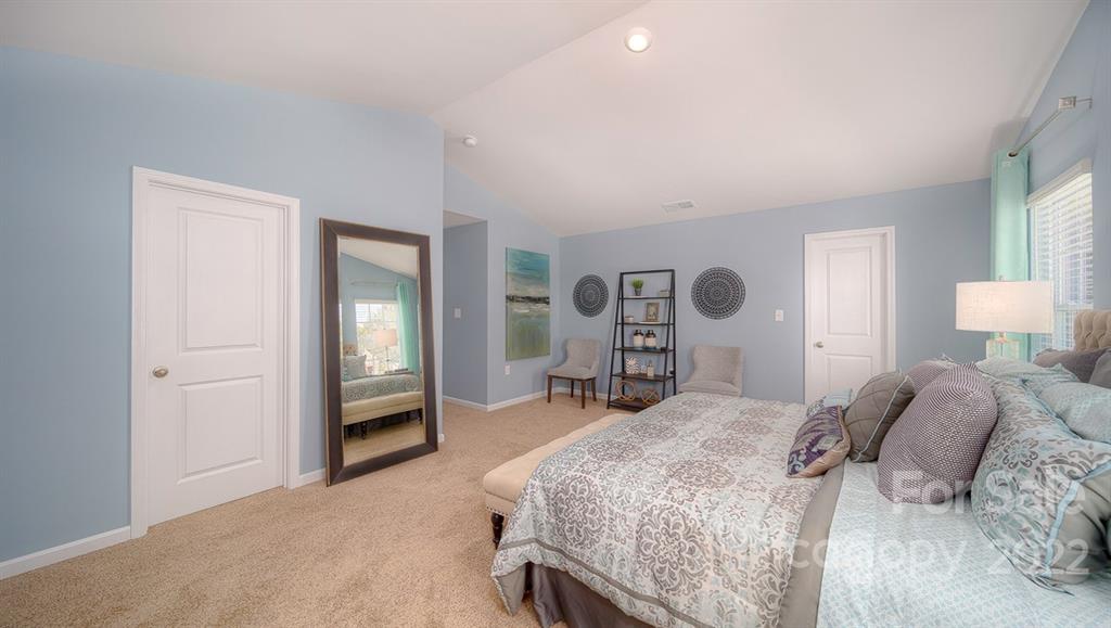 309 Gaines Road Clover, SC 29710 - Photo 35 of 48 a bedroom with a bed and a chandelier