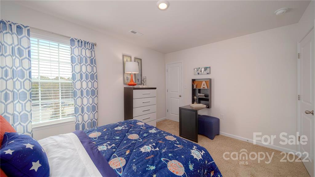 309 Gaines Road Clover, SC 29710 - Photo 42 of 48 a bedroom with a bed and a television