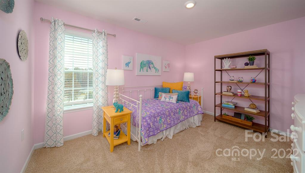 309 Gaines Road Clover, SC 29710 - Photo 7 of 48 a bedroom with a bed and a window