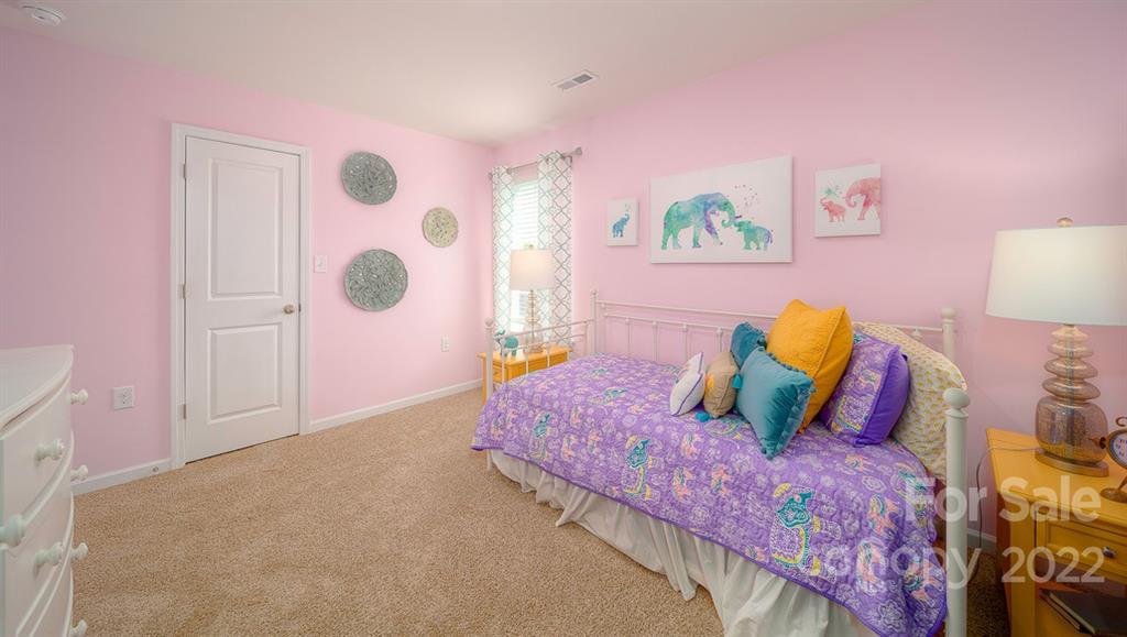 309 Gaines Road Clover, SC 29710 - Photo 8 of 48 a bed room with a bed and a painting on the wall