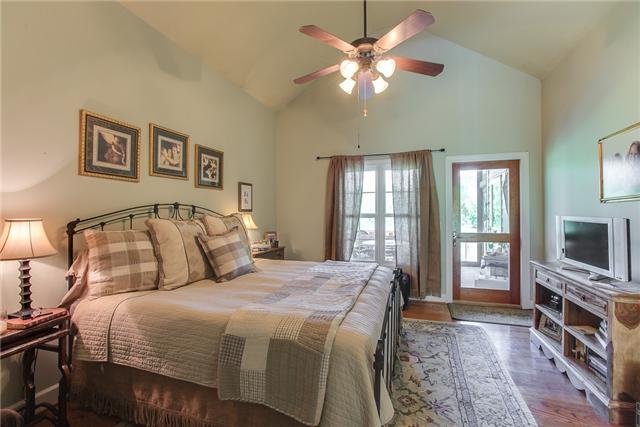 4366 Arno Road Franklin, TN 37064 - Photo 10 of 20 a bedroom with a large bed and a tv