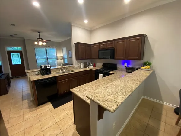 a kitchen with a sink and cabinets