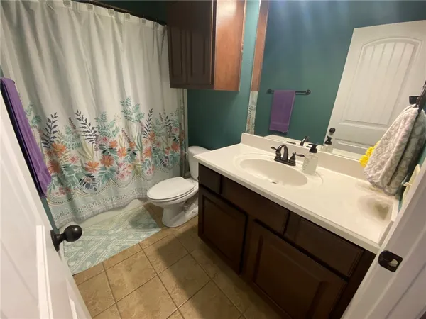 a bathroom with a sink and toilet