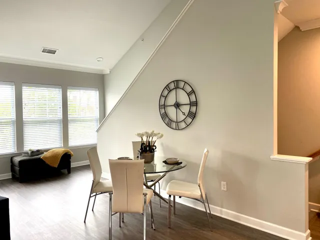 a view of a dining room with furniture window and outside view